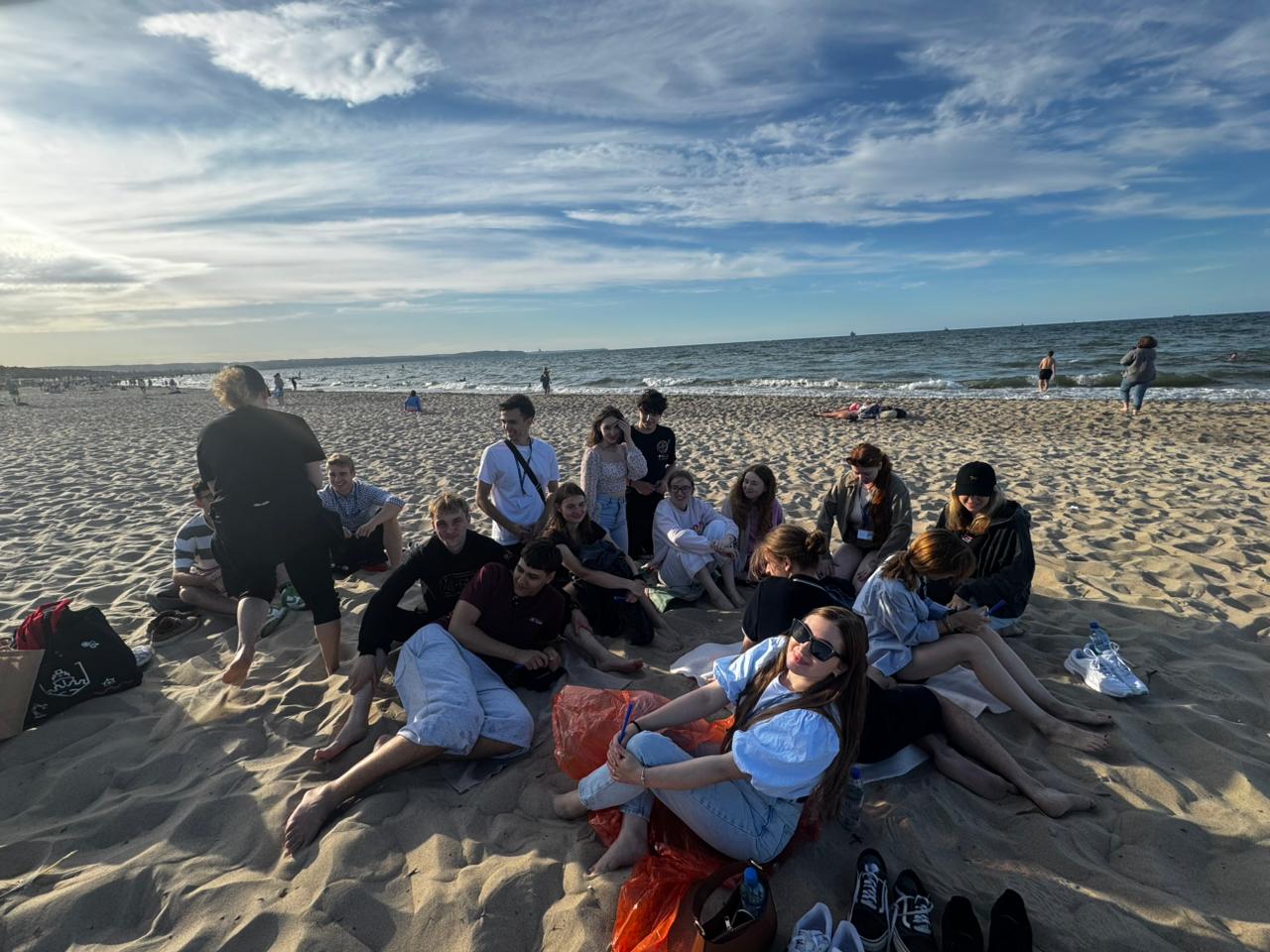 A photo of PULA project participants reflecting on the beach.